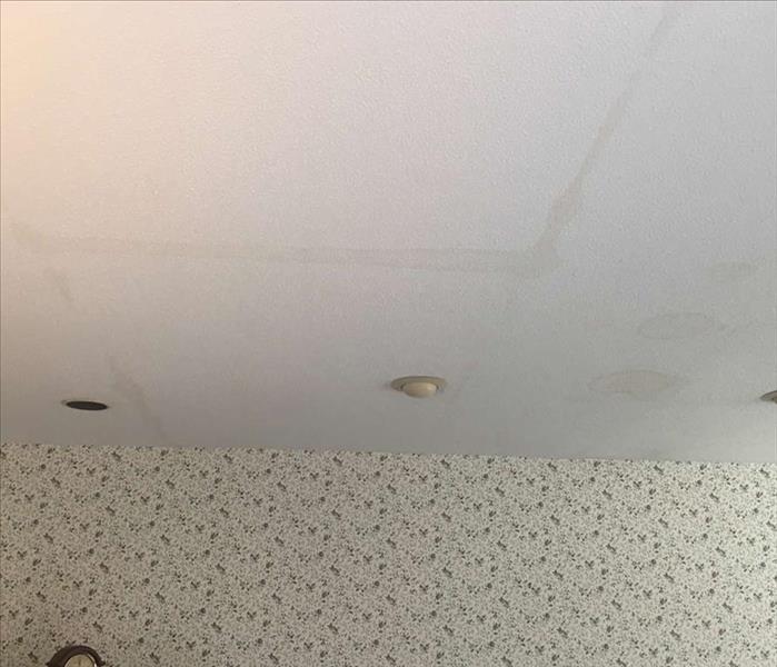 water stains on ceiling from water leaks on second floor