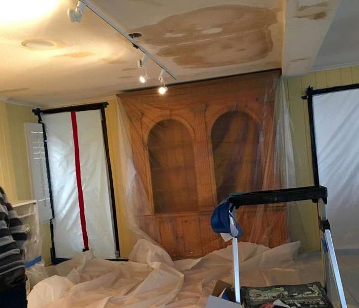 water stains on ceiling, plastic film covering furniture, doors & floor